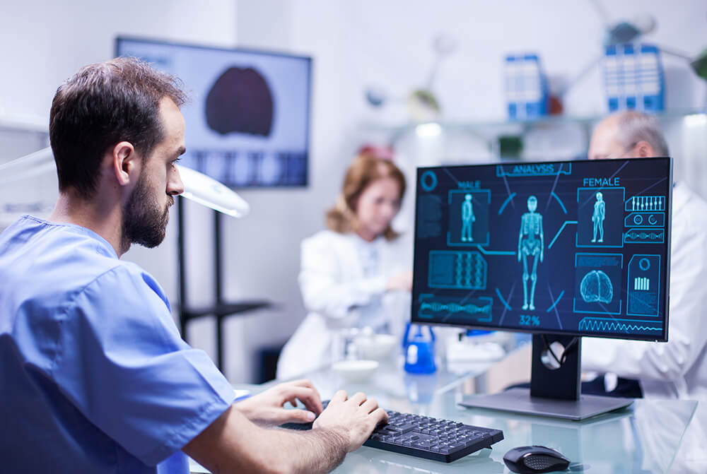 young-technician-typing-data-for-human-body-neurol-G5F9M73.jpg
